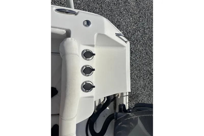 Slide: The Image of 2016 Sea Hunt Ultra 225 boat interior with control knobs and seating detail. - 25