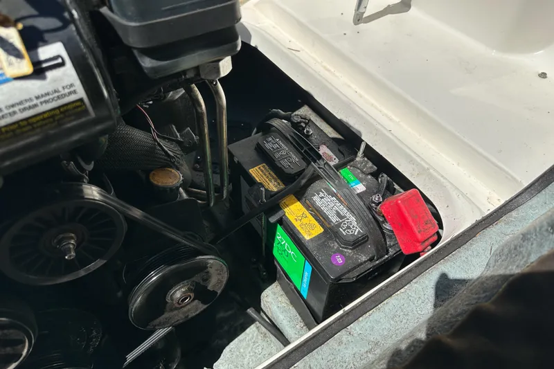 Slide: The Image of Battery compartment of a 1998 Sea Ray 215 Express Cruiser boat engine. - 16