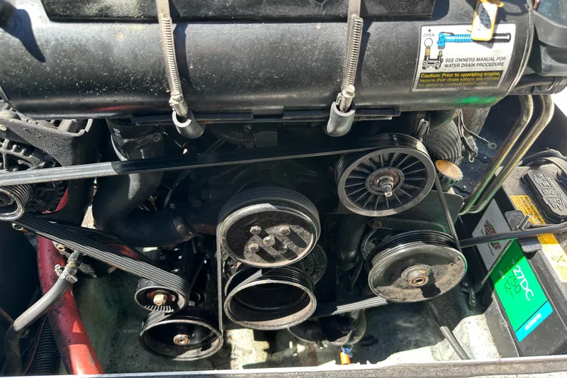 Slide: The Image of Engine components of a 1998 Sea Ray 215 Express Cruiser boat. - 17