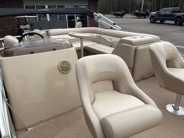 Slide: The Image of Interior of a 2012 Bennington 20 SF pontoon boat with beige seating. - 11