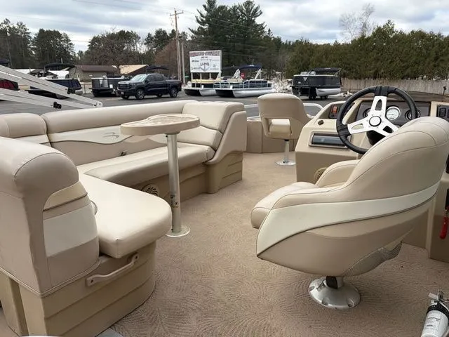 Slide: The Image of Interior of a 2012 Bennington 20 SF pontoon boat with beige seating. - 12
