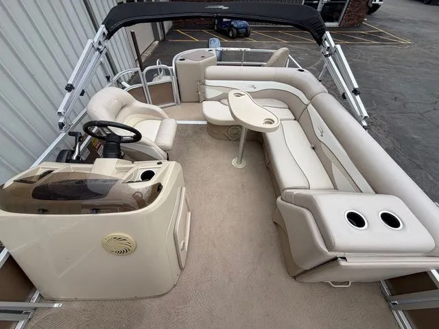 Slide: The Image of Interior of a 2012 Bennington 20 SF pontoon boat with beige seating. - 13