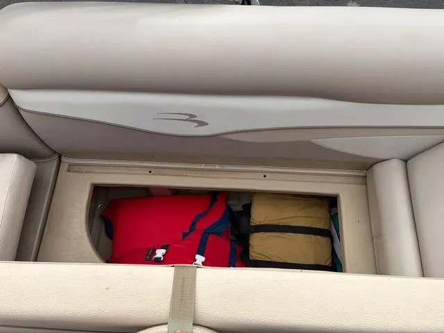 Slide: The Image of Storage compartment in Bennington 20 SF boat with life jackets, 2012 model. - 23