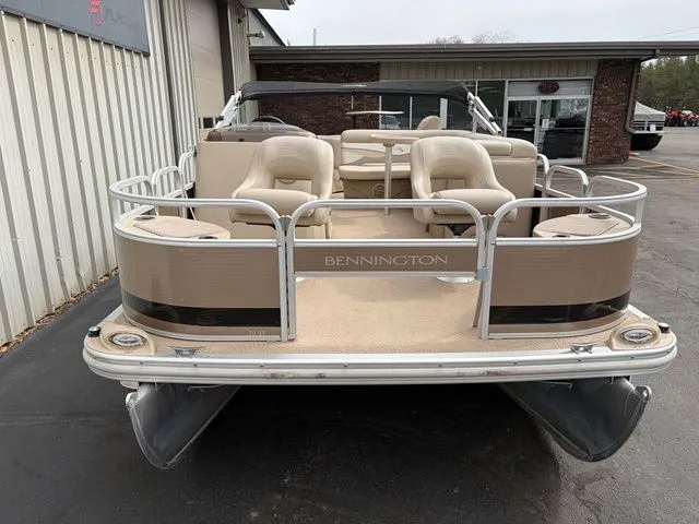 Slide: The Image of 2012 Bennington 20 SF pontoon boat parked outdoors. - 3