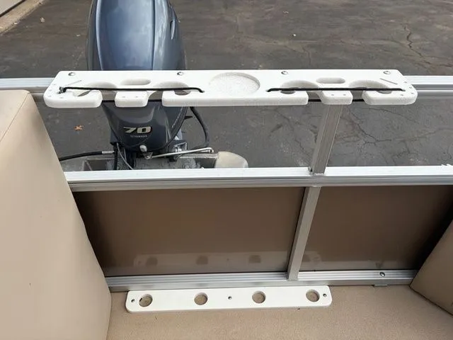 Slide: The Image of 2012 Bennington 20 SF boat with outboard motor and fishing rod holder. - 32