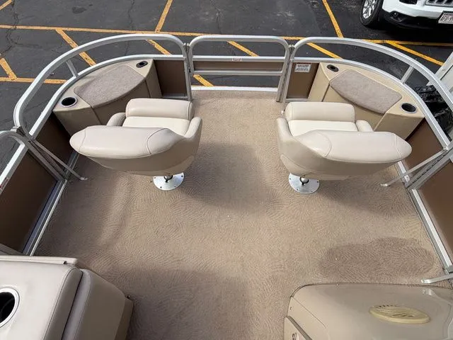 Slide: The Image of Interior of a 2012 Bennington 20 SF pontoon boat with beige seating. - 33