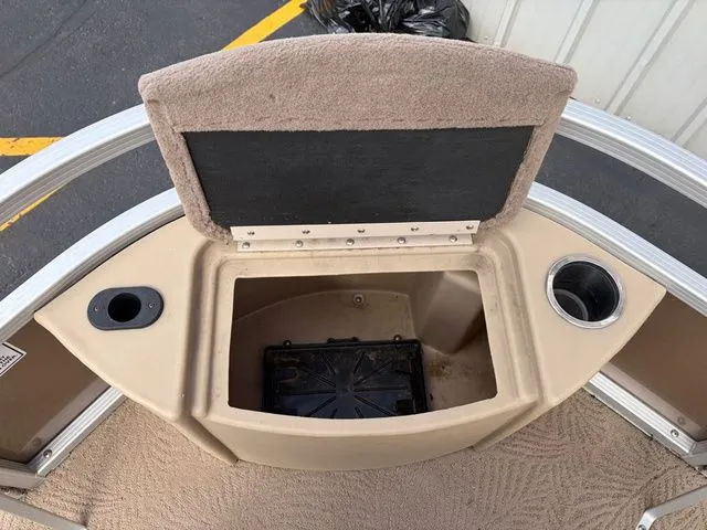 Slide: The Image of Bennington 20 SF 2012 boat with open storage compartment and cup holder. - 37