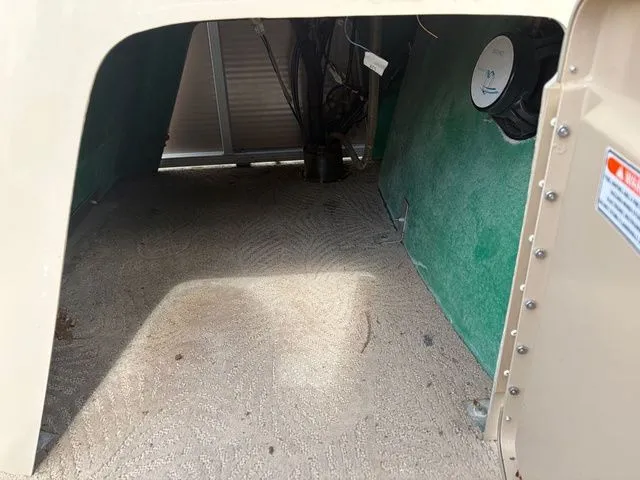 Slide: The Image of Interior of 2012 Bennington 20 SF boat showing carpet and wiring. - 41