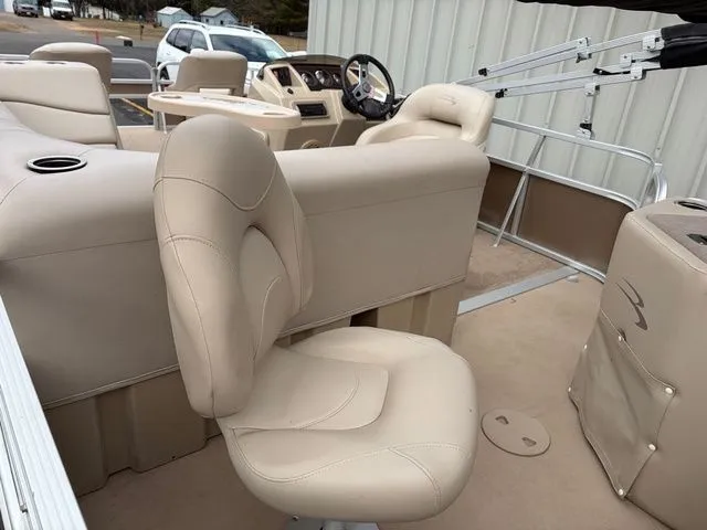 Slide: The Image of Interior of a 2012 Bennington 20 SF pontoon boat with beige seating. - 8