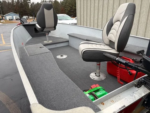 Slide: The Image of Interior of a 1997 Lund 14 Rebel boat with two seats. - 10