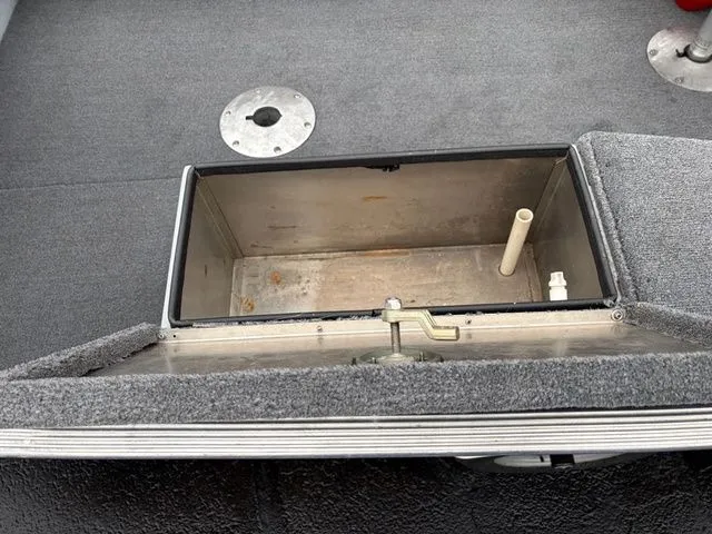 Slide: The Image of Open storage compartment in 1997 Lund 14 Rebel boat. - 15