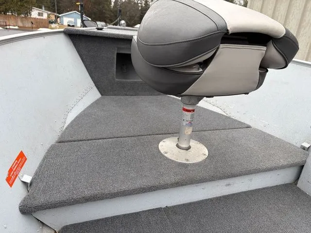 Slide: The Image of Interior of a 1997 Lund 14 Rebel boat with gray seat. - 21