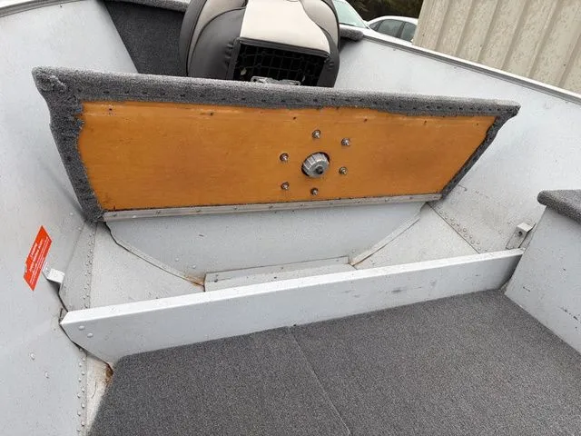 Slide: The Image of Interior view of a 1997 Lund 14 Rebel boat with gray carpeting. - 22