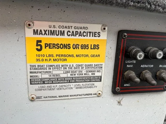 Slide: The Image of 1997 Lund 14 Rebel boat capacity label, maximum capacity 5 persons or 695 lbs. - 24