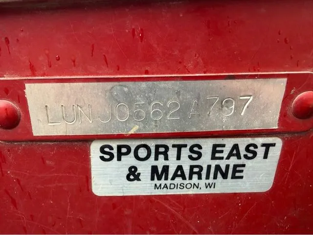 Slide: The Image of Red boat with serial number and dealer sticker, Lund 14 Rebel 1997. - 25