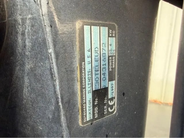 Slide: The Image of Close-up of a nameplate on a 1997 Lund 14 Rebel boat. - 26