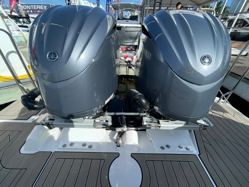 Slide: The Image of 2023 Cutwater C-288 boat with dual Yamaha outboard engines at a marina. - 10