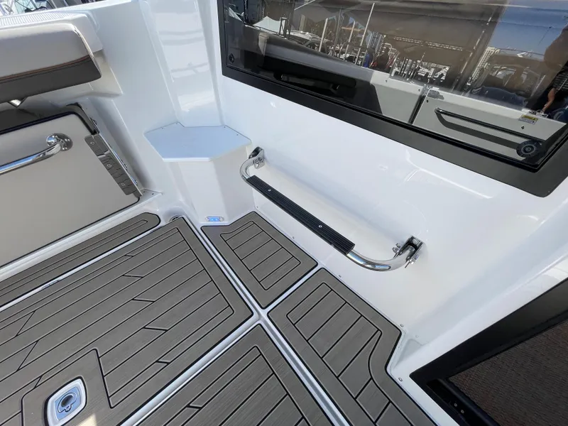 Slide: The Image of 2023 Cutwater C-288 boat interior with non-slip flooring and stainless steel handrails. - 19