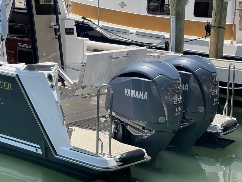 Slide: The Image of 2023 Cutwater C-288 boat with twin Yamaha 250 V6 outboard engines docked. - 2
