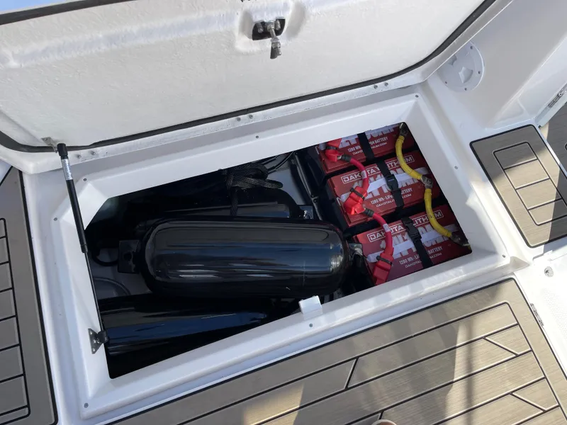 Slide: The Image of Storage compartment of 2023 Cutwater C-288 boat with batteries and fenders. - 20