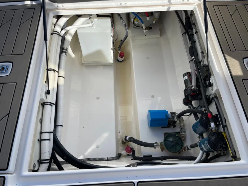 Slide: The Image of 2023 Cutwater C-288 boat engine compartment with various components and wiring. - 22