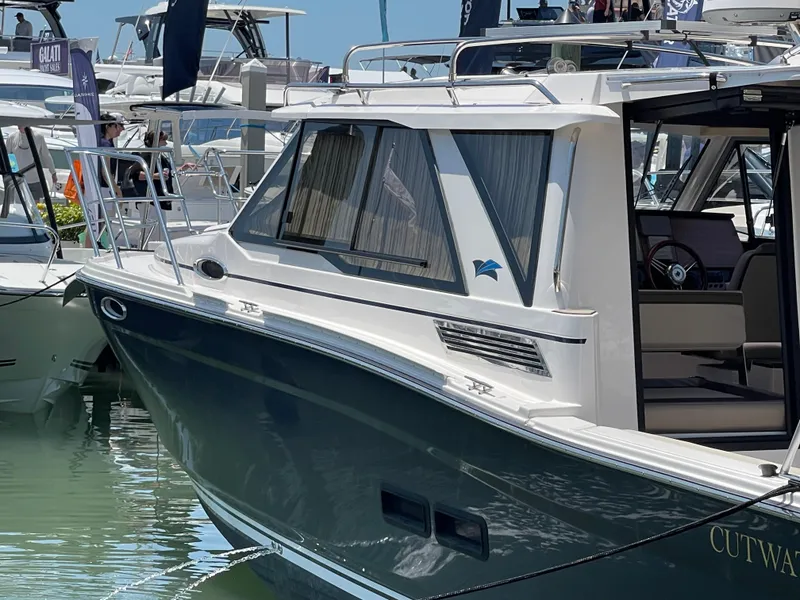 Slide: The Image of 2023 Cutwater C-288 boat docked at marina, side view. - 3