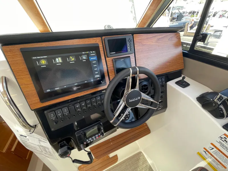 Slide: The Image of 2023 Cutwater C-288 boat helm with modern controls and navigation systems. - 30