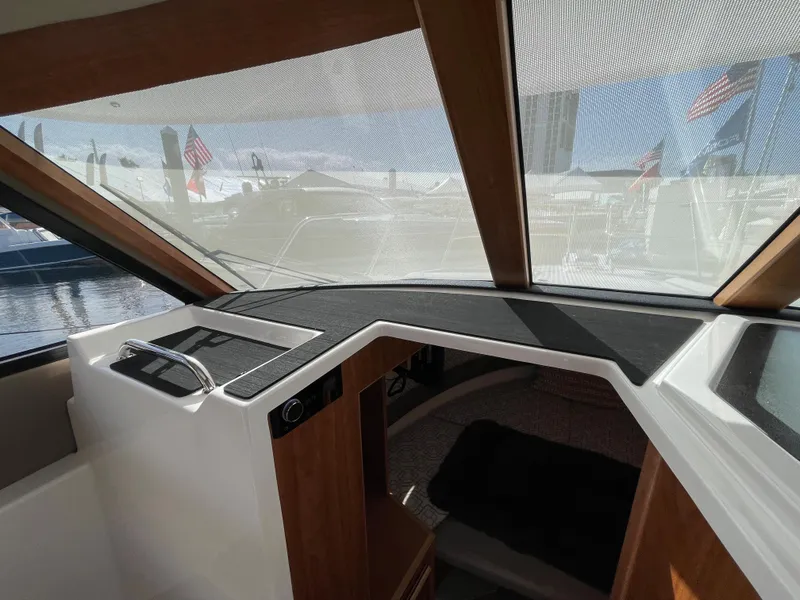 Slide: The Image of Interior view of 2023 Cutwater C-288 boat cabin with large windows. - 36