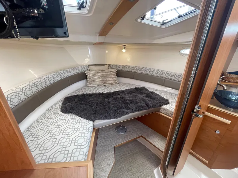 Slide: The Image of 2023 Cutwater C-288 boat interior with cozy bed and modern design. - 42