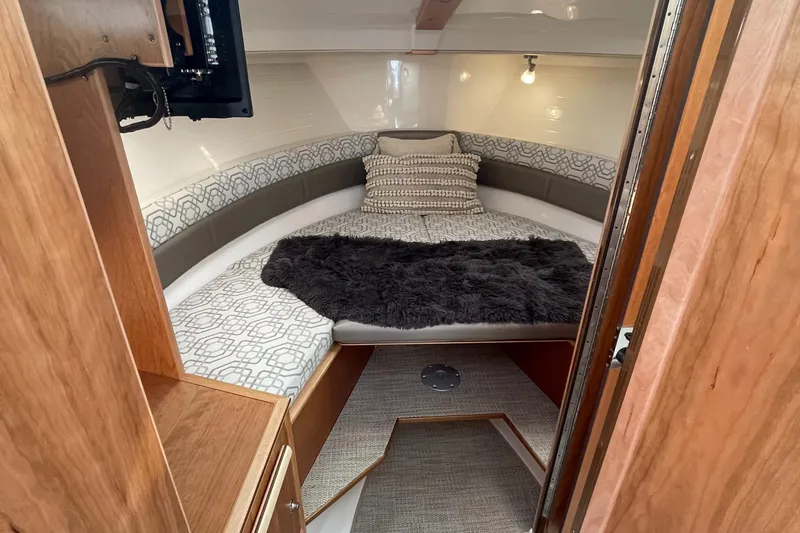 Slide: The Image of 2023 Cutwater C-288 cabin interior with cozy bed and modern amenities. - 44