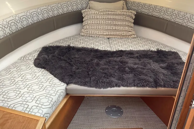 Slide: The Image of 2023 Cutwater C-288 boat interior cabin with cozy bed and plush pillows. - 45
