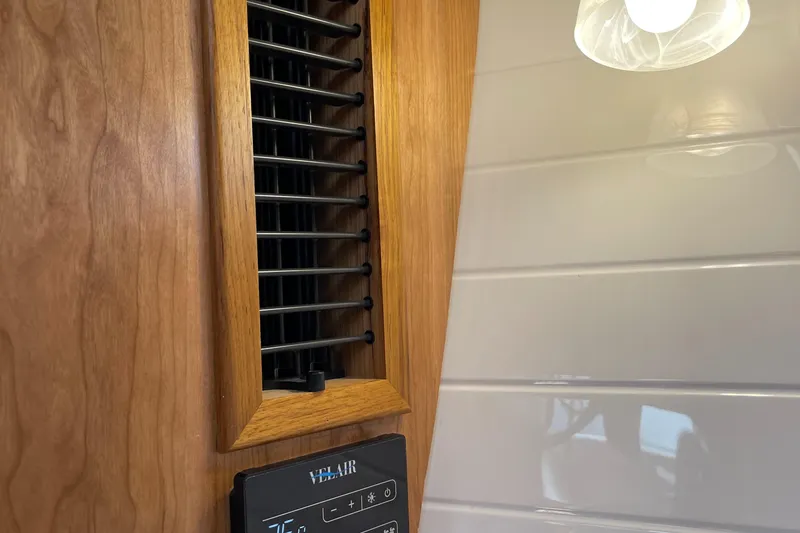 Slide: The Image of 2023 Cutwater C-288 interior vent and control panel with wooden trim. - 47