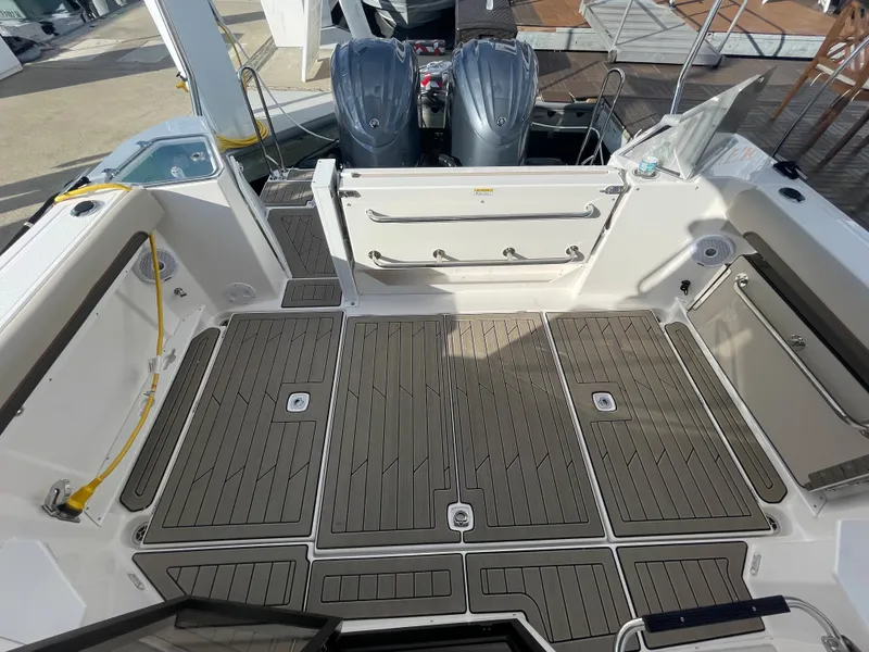 Slide: The Image of 2023 Cutwater C-288 boat deck with twin outboard engines. - 8