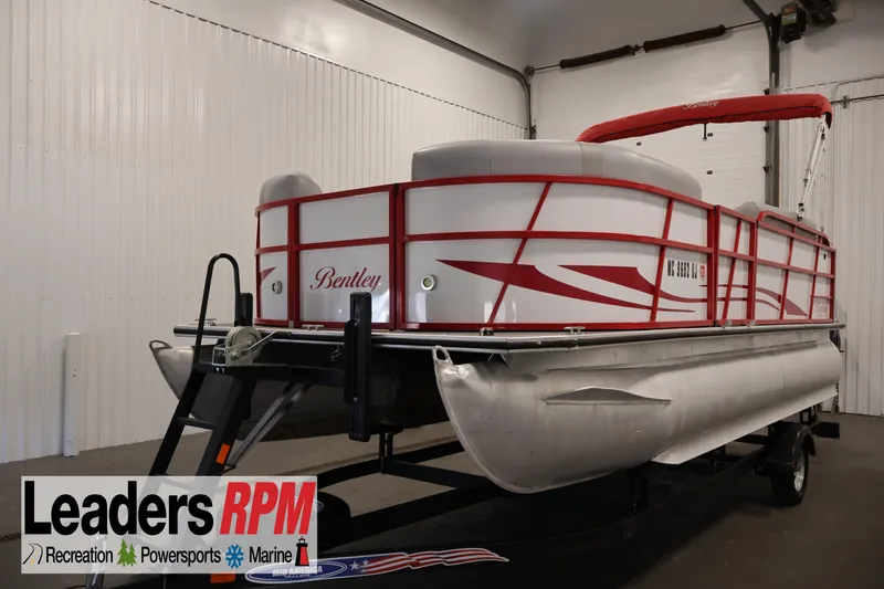 The Image of 2019 Bentley Pontoons 200 CRUISE in showroom, featuring red accents and canopy. - 1
