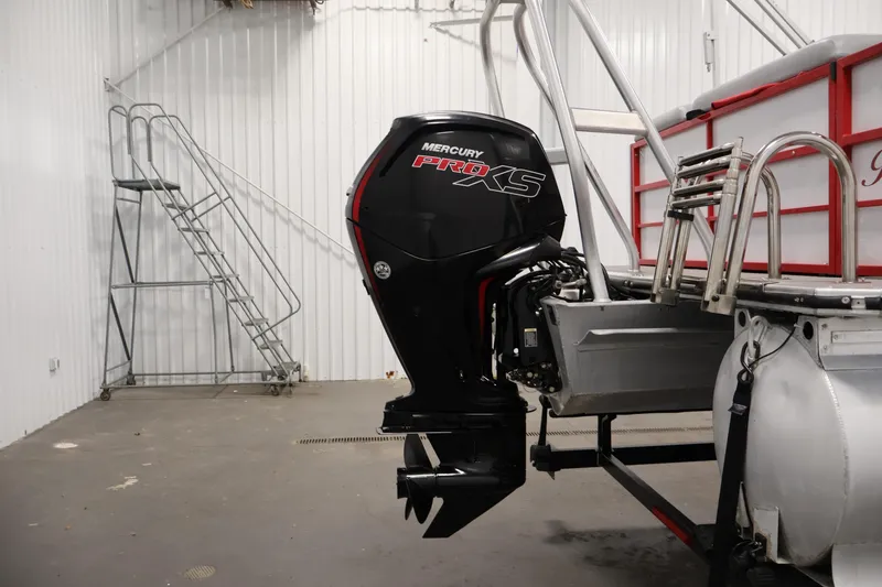 Slide: The Image of 2019 Bentley Pontoons 200 CRUISE with Mercury Pro XS outboard motor in a storage facility. - 33