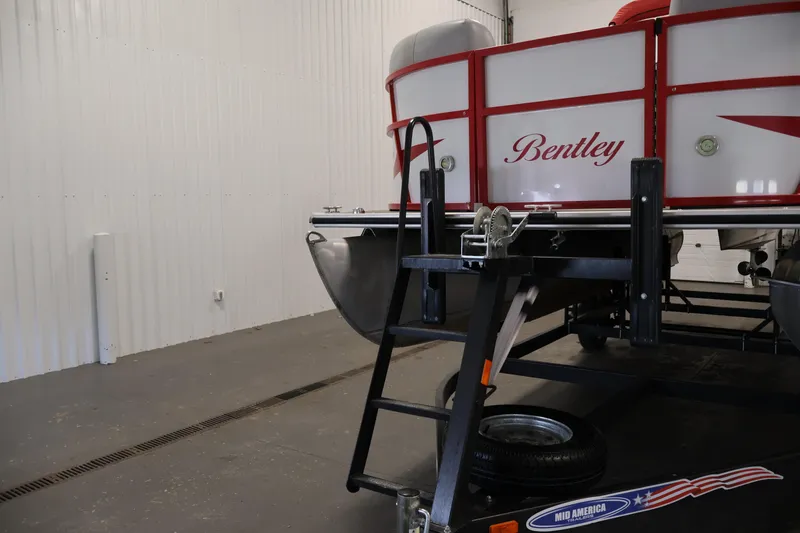 Slide: The Image of 2019 Bentley Pontoons 200 CRUISE in a garage, showcasing rear view and trailer. - 37