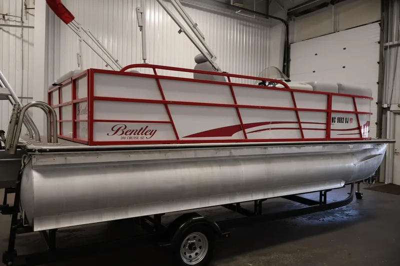 Slide: The Image of 2019 Bentley Pontoons 200 CRUISE in a garage, featuring red accents and sleek design. - 4