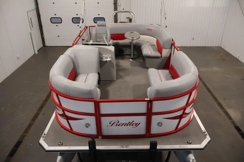 Slide: The Image of 2019 Bentley Pontoons 200 CRUISE with red and gray seating in a spacious indoor setting. - 8