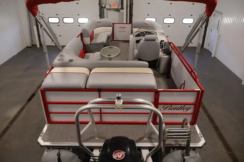 Slide: The Image of 2019 Bentley Pontoons 200 CRUISE interior with red accents and seating arrangement. - 9