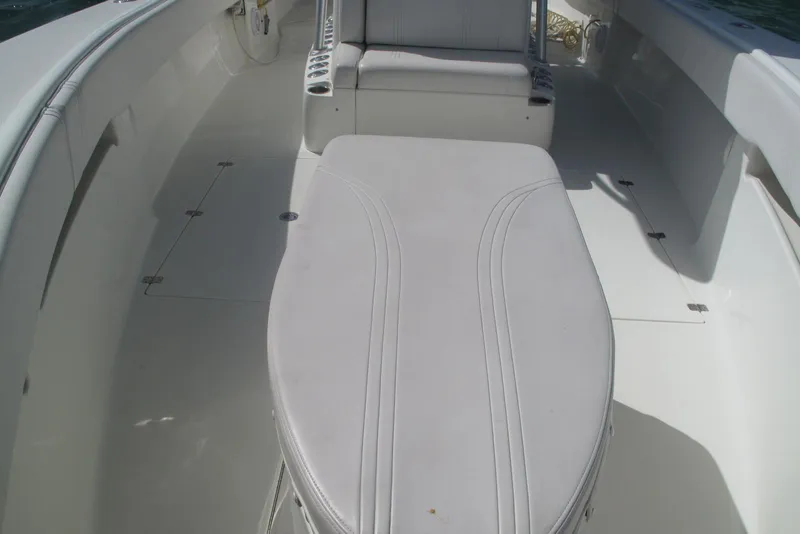 Slide: The Image of 2017 SeaVee 340B boat interior with cushioned seating and storage compartments. - 12