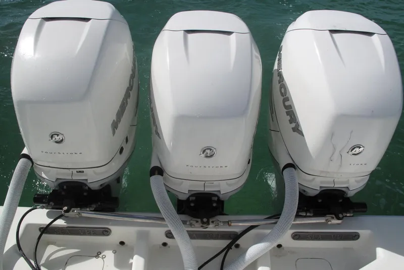 Slide: The Image of Triple Mercury outboard engines on a 2017 SeaVee 340B boat. - 16