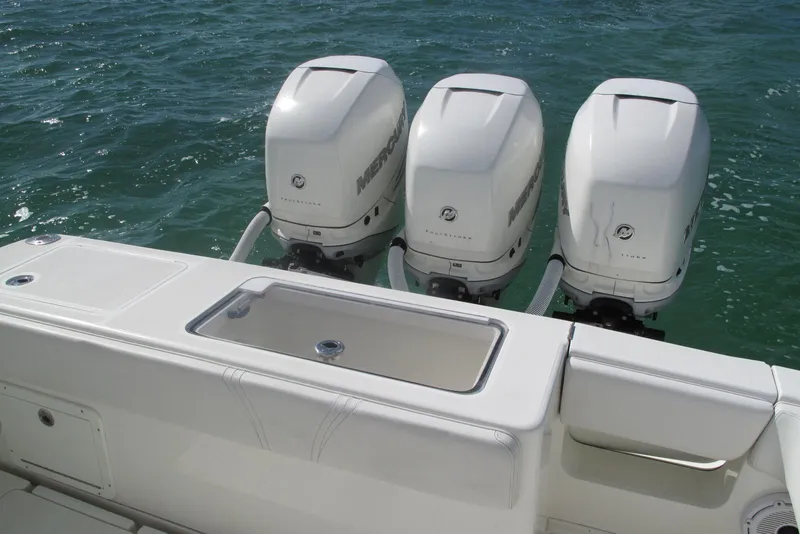 Slide: The Image of 2017 SeaVee 340B boat with triple Mercury outboard engines on the water. - 17
