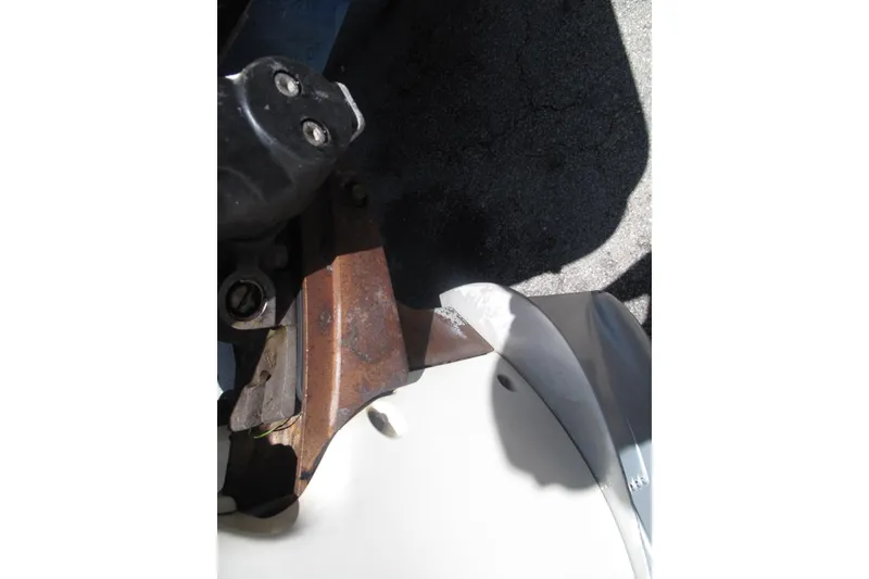 Slide: The Image of Close-up of a 2017 SeaVee 340B boat component with visible rust and shadow. - 19