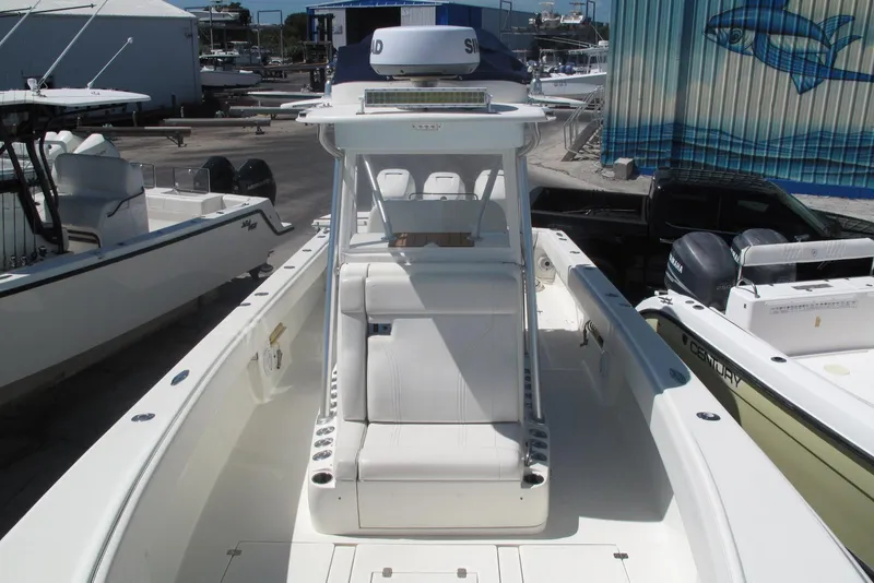 Slide: The Image of 2017 SeaVee 340B boat with center console, docked at a marina. - 22