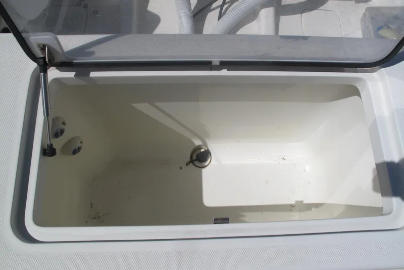 Slide: The Image of Open storage compartment on 2017 SeaVee 340B boat, showing interior details. - 23