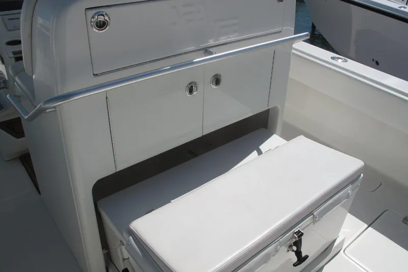 Slide: The Image of 2017 SeaVee 340B boat interior with storage compartment and cushioned seating. - 24