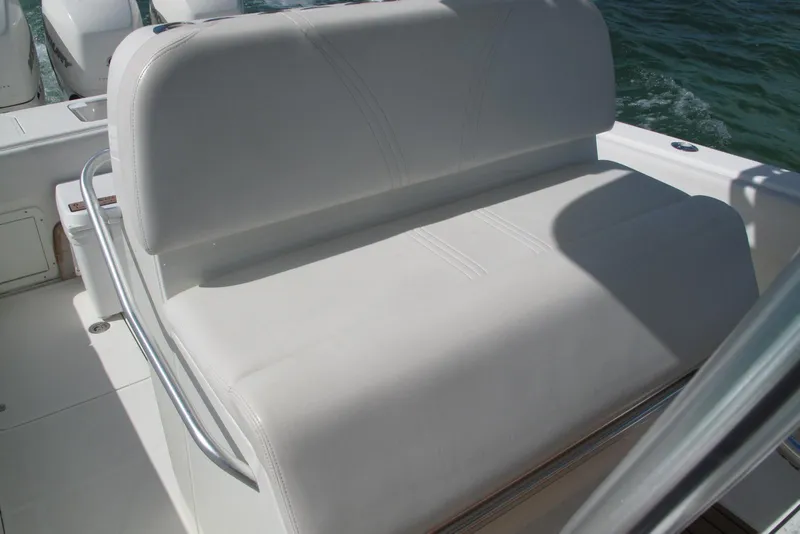 Slide: The Image of White cushioned seating on 2017 SeaVee 340B boat with ocean backdrop. - 29
