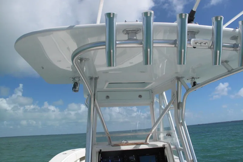 Slide: The Image of 2017 SeaVee 340B boat with rod holders, ocean view, and clear blue sky. - 3