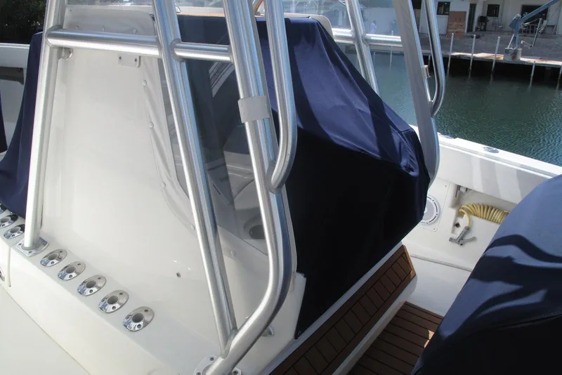 Slide: The Image of 2017 SeaVee 340B boat interior with covered console and rod holders. - 7