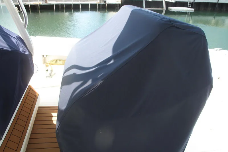 Slide: The Image of Covered engine on 2017 SeaVee 340B boat, docked by the water. - 8